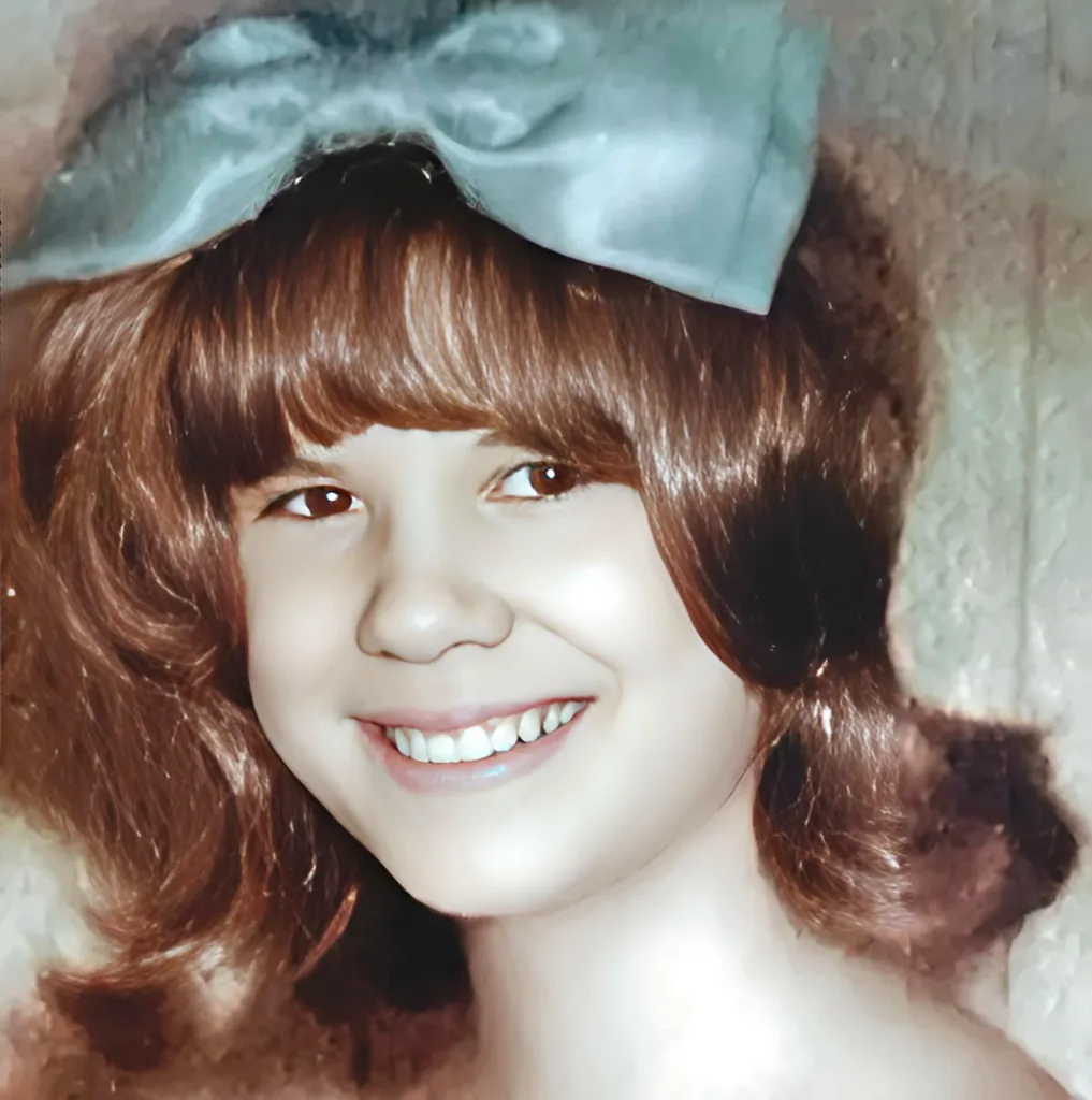 Joan Dymond, Wilkes-Barre, portrait, while junior bridesmaid at her sister's wedding